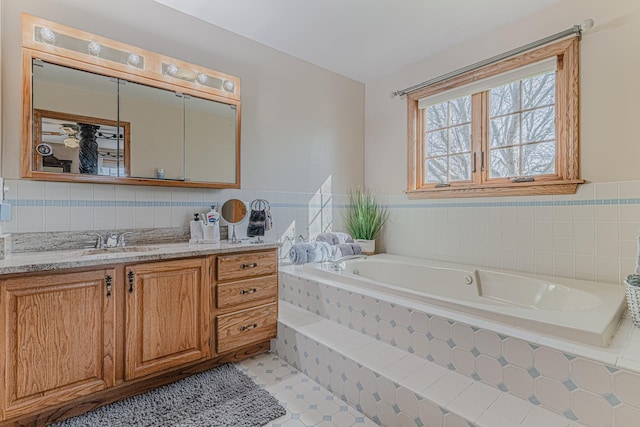 39935 N Prairie View Dr, Wadsworth, IL 60083 - bathroom with vanity, a garden tub, and tile walls
