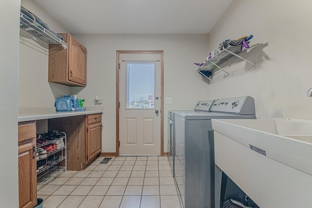 39935 N Prairie View Dr, Wadsworth, IL 60083 - laundry room with washer and dryer, light tile patterned flooring, and cabinet space