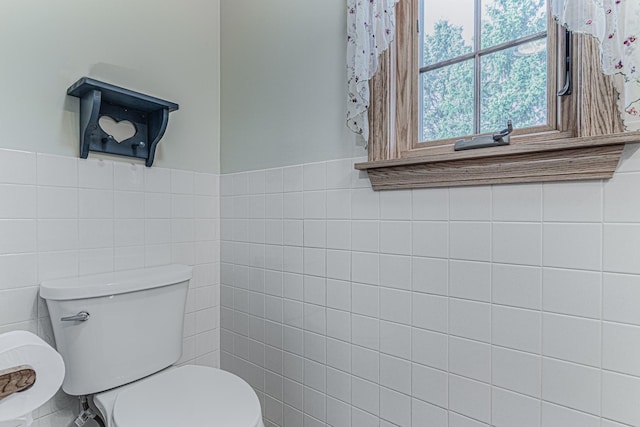 39935 N Prairie View Dr, Wadsworth, IL 60083 - bathroom featuring tile walls, toilet, and a wainscoted wall