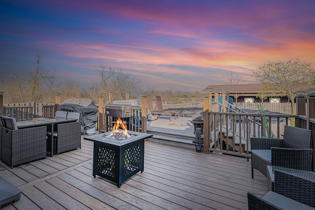 39935 N Prairie View Dr, Wadsworth, IL 60083 - deck at dusk featuring a fire pit, stairway, and fence