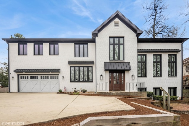 16 W Birchwood Ave, Hinsdale, IL 60521 - modern farmhouse featuring brick siding, concrete driveway, and a garage