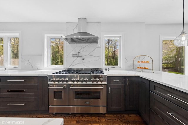 16 W Birchwood Ave, Hinsdale, IL 60521 - kitchen featuring range with two ovens, wall chimney range hood, tasteful backsplash, and light stone countertops