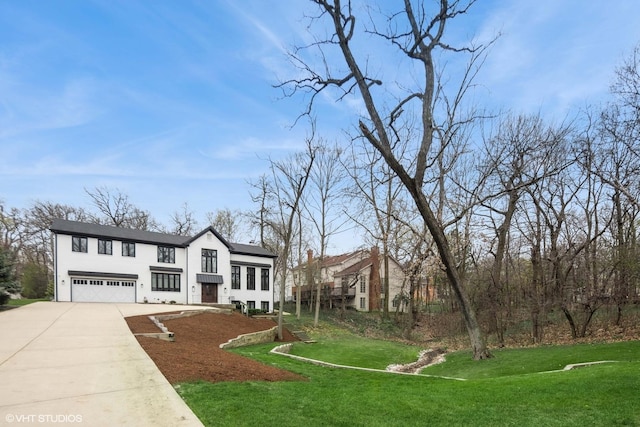 16 W Birchwood Ave, Hinsdale, IL 60521 - view of front of house featuring an attached garage, concrete driveway, and a front lawn
