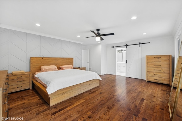 16 W Birchwood Ave, Hinsdale, IL 60521 - bedroom featuring a barn door, crown molding, recessed lighting, wood finished floors, and ensuite bath