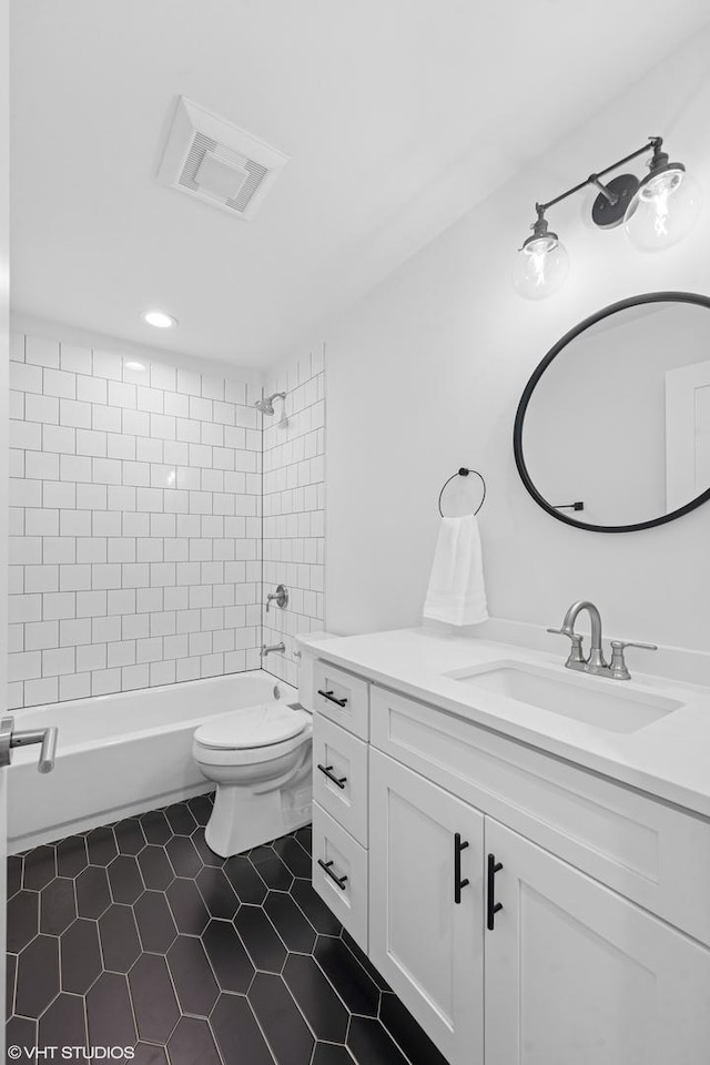 16 W Birchwood Ave, Hinsdale, IL 60521 - bathroom with vanity, washtub / shower combination, tile patterned floors, toilet, and recessed lighting
