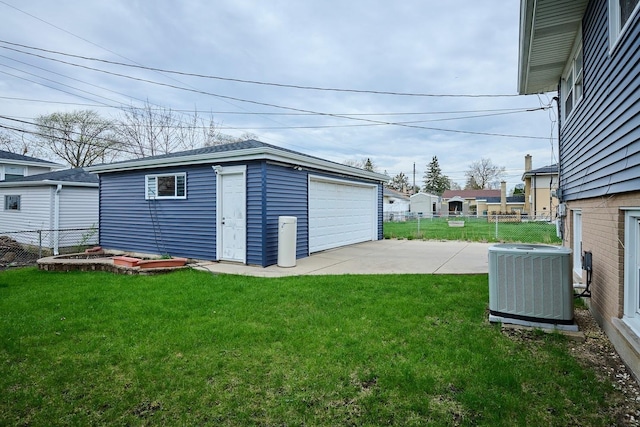 8856 N Merrill St, Niles, IL 60714 - detached garage featuring fence and central air condition unit