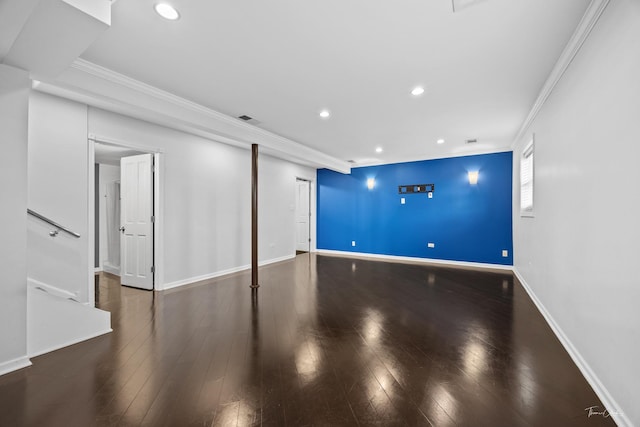 unfurnished living room with wood finished floors, recessed lighting, ornamental molding, and baseboards