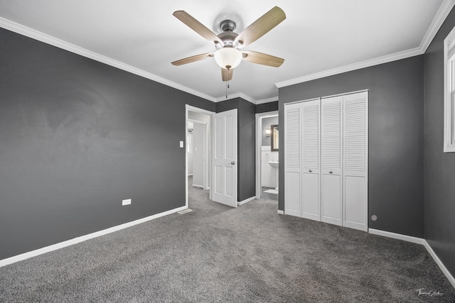 unfurnished bedroom featuring carpet flooring, a closet, ceiling fan, crown molding, and baseboards