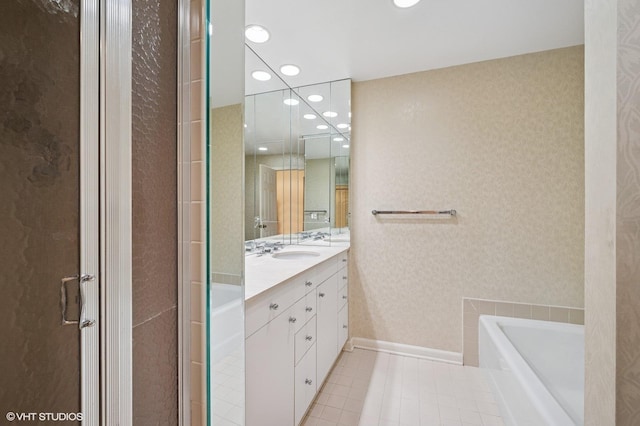 1220 Rudolph Rd Unit 5F, Northbrook, IL 60062 - full bathroom with recessed lighting, double vanity, a garden tub, tile patterned flooring, and baseboards