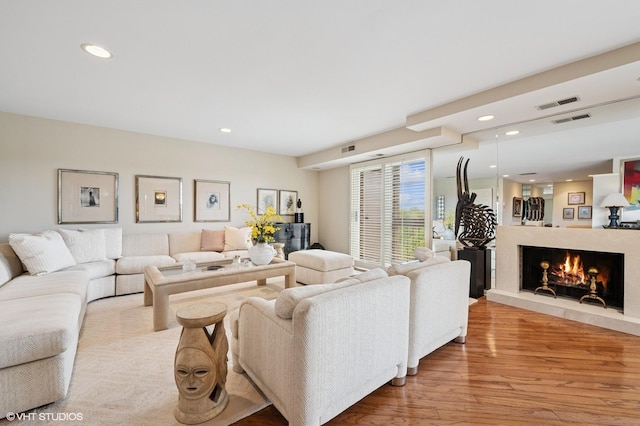 1220 Rudolph Rd Unit 5F, Northbrook, IL 60062 - living area with wood finished floors, recessed lighting, and a lit fireplace