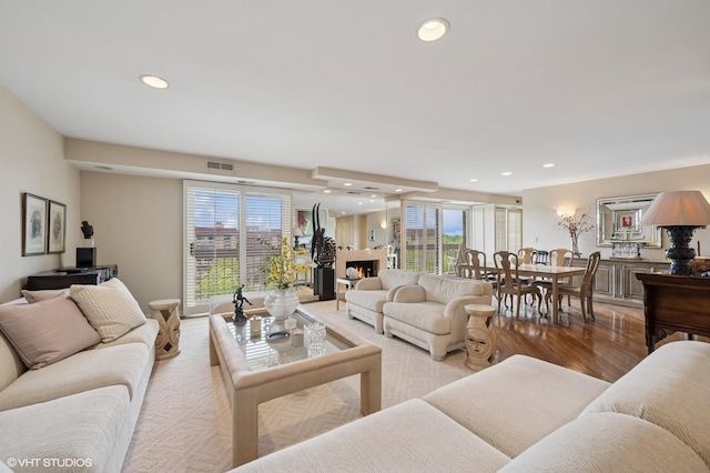 1220 Rudolph Rd Unit 5F, Northbrook, IL 60062 - living area with recessed lighting, a lit fireplace, and wood finished floors