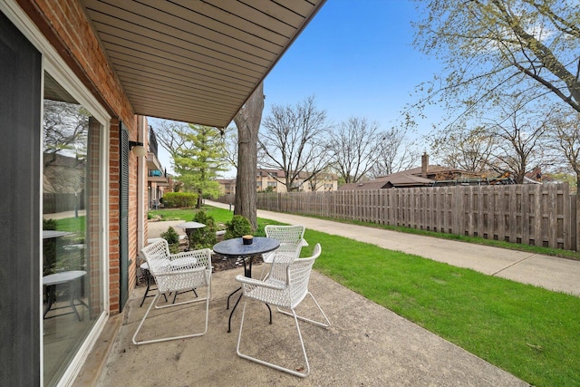 view of patio featuring outdoor dining space and a fenced backyard