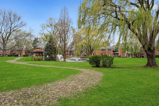 view of community featuring a gazebo and a lawn