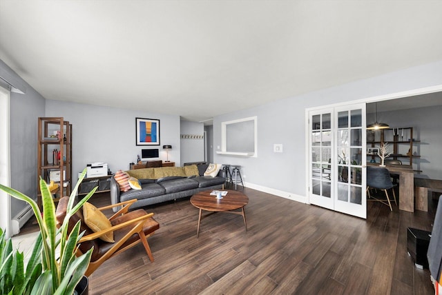 living area with french doors, wood finished floors, and baseboards