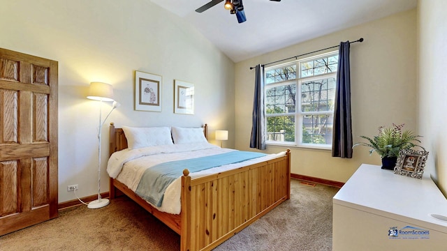 bedroom with light carpet, lofted ceiling, baseboards, and ceiling fan