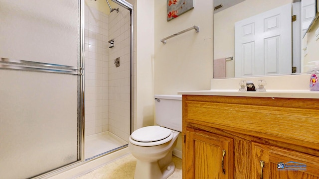 bathroom with a stall shower, toilet, and vanity