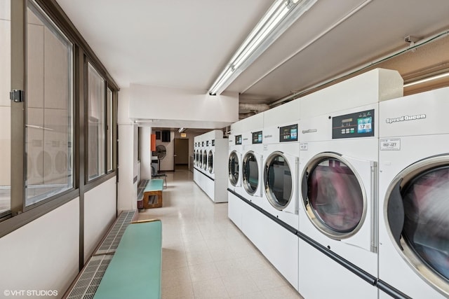 4850 S Lake Park Ave Unit 510, Chicago, IL 60615 - common laundry area featuring separate washer and dryer and light floors