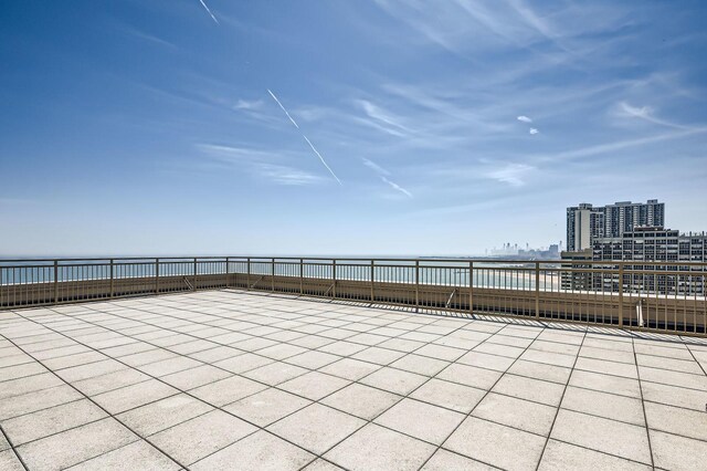 6301 N Sheridan Rd Unit 10F, Chicago, IL 60660 - view of patio / terrace featuring a view of city, a water view, and fence