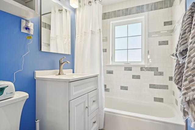bathroom featuring shower / bath combination with curtain, toilet, and vanity