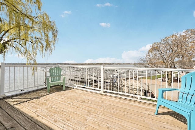 wooden deck with a water view