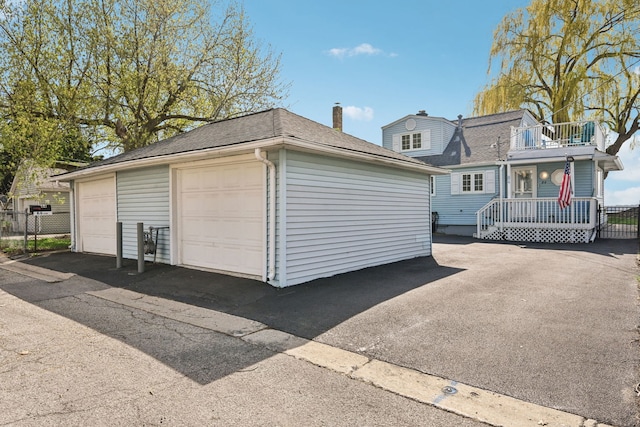 detached garage with fence