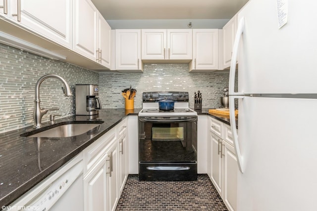 kitchen featuring a sink, white cabinets, decorative backsplash, and white appliances