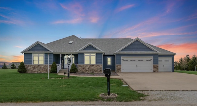 craftsman inspired home with concrete driveway, a lawn, stone siding, a shingled roof, and an attached garage