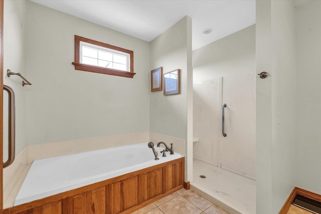 full bath with a bath, toilet, walk in shower, and tile patterned flooring