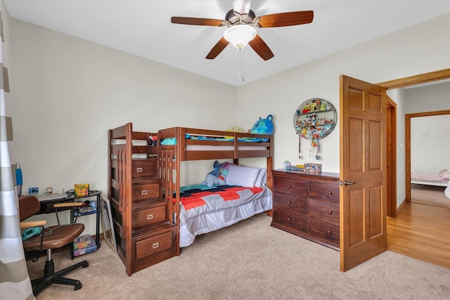 bedroom featuring ceiling fan and carpet