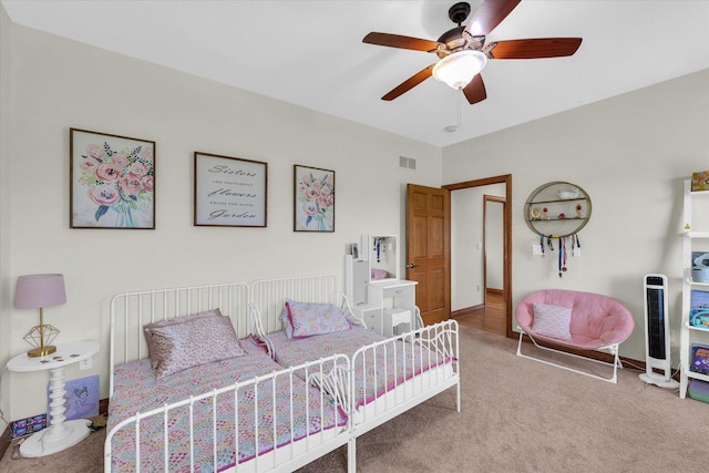 bedroom featuring baseboards, a ceiling fan, carpet flooring, and visible vents