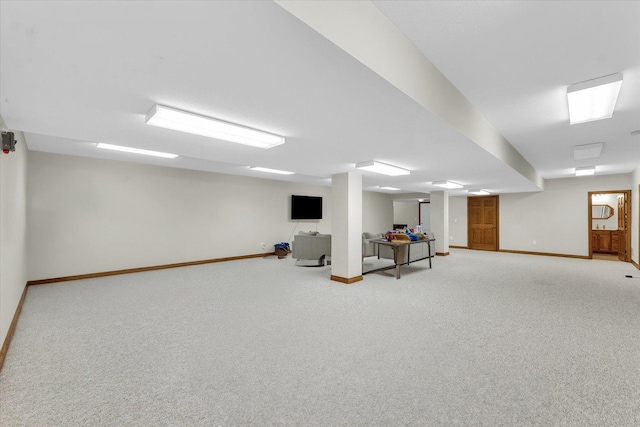 finished below grade area with light carpet and baseboards