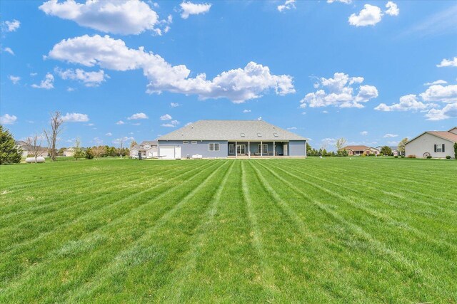 back of house featuring a yard