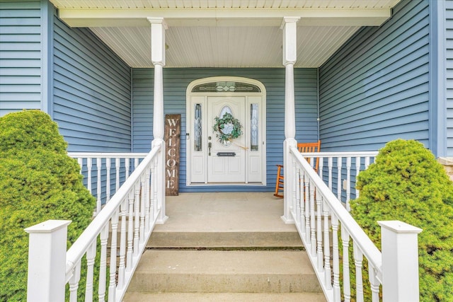view of exterior entry with covered porch