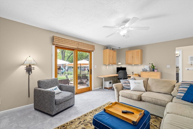 1088 Alameda Dr, Aurora, IL 60506 - living area featuring a desk, light colored carpet, ceiling fan, and a textured ceiling