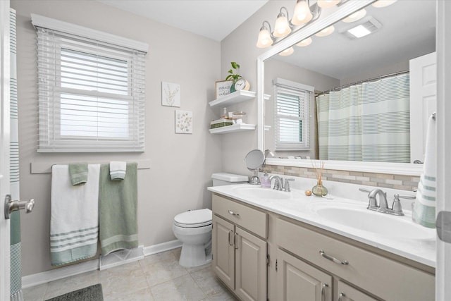 1088 Alameda Dr, Aurora, IL 60506 - full bathroom with double vanity, decorative backsplash, tile patterned floors, and a shower with curtain