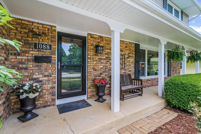 1088 Alameda Dr, Aurora, IL 60506 - doorway to property with a porch and brick siding