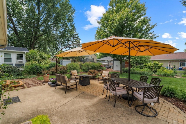 1088 Alameda Dr, Aurora, IL 60506 - view of patio featuring an outdoor fire pit, a storage unit, and outdoor dining space
