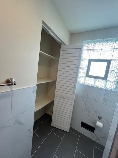 bathroom with tile patterned floors