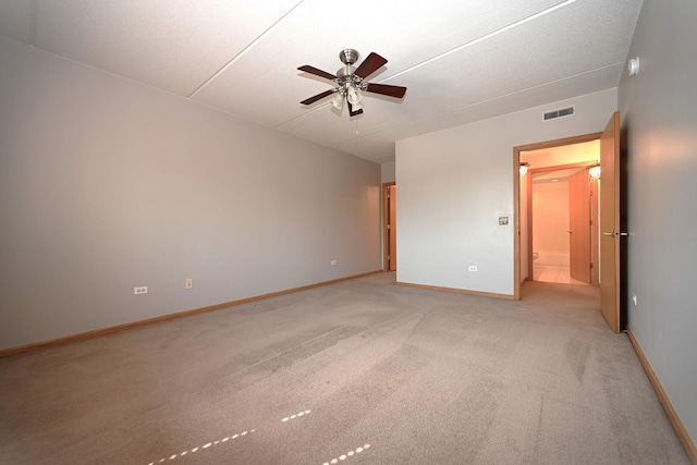 unfurnished bedroom featuring light colored carpet, baseboards, and ceiling fan