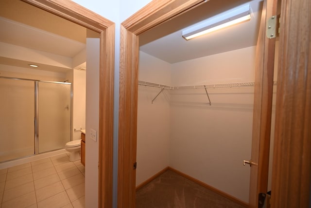 walk in closet featuring light tile patterned floors