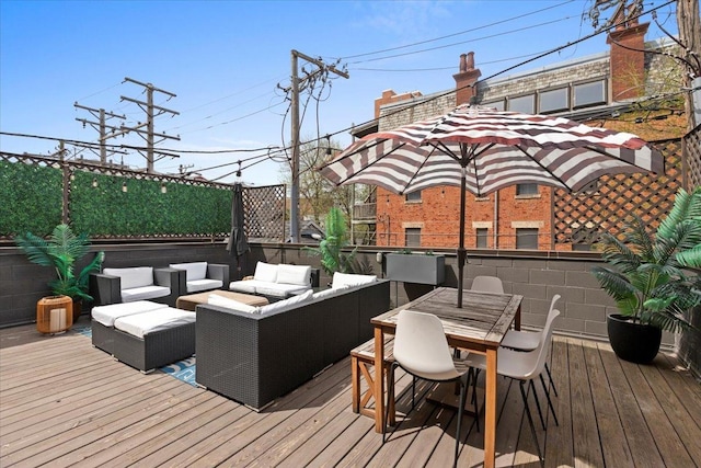 wooden deck featuring outdoor lounge area