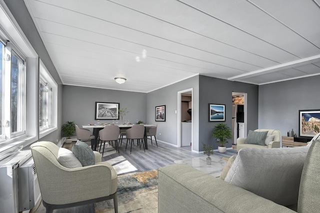 living room featuring wood finished floors and baseboards