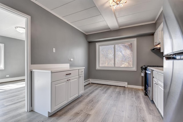 kitchen with crown molding, light wood finished floors, freestanding refrigerator, and a baseboard radiator
