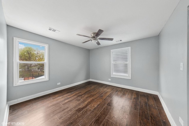 509 W 81st St, Chicago, IL 60620 - unfurnished room featuring dark wood-style floors, baseboards, and ceiling fan