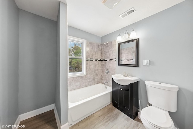 509 W 81st St, Chicago, IL 60620 - full bath featuring wood finished floors, toilet, bathing tub / shower combination, and vanity