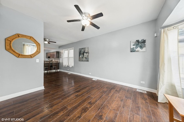 509 W 81st St, Chicago, IL 60620 - unfurnished living room with a ceiling fan, wood finished floors, and baseboards