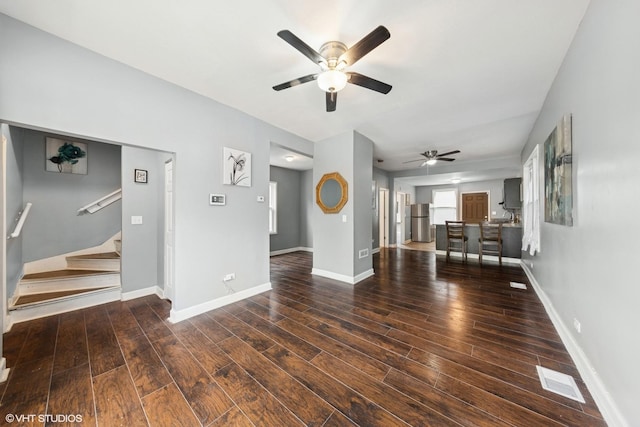 509 W 81st St, Chicago, IL 60620 - unfurnished living room with ceiling fan, wood finished floors, stairs, and baseboards