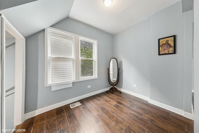 509 W 81st St, Chicago, IL 60620 - empty room with vaulted ceiling, dark wood finished floors, and baseboards