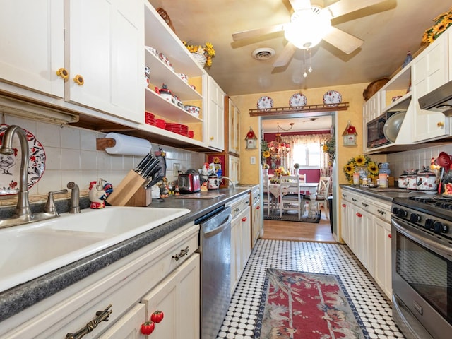 17237 Greenbay Ave, Lansing, IL 60438 - kitchen with a sink, decorative backsplash, open shelves, white cabinetry, and appliances with stainless steel finishes