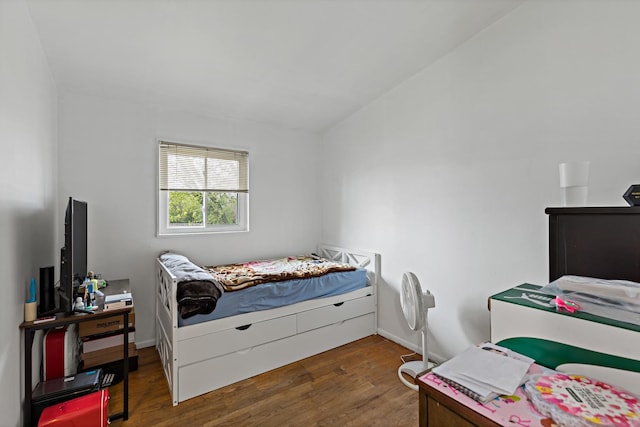 bedroom featuring wood finished floors